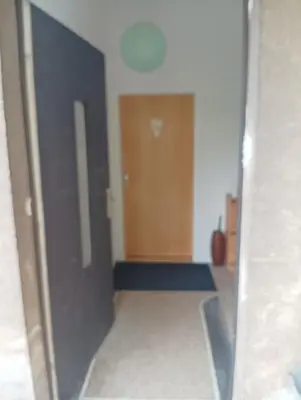 a room with a hallway with a door and a room with a hallway at Sweet home apartment Kobylisy in Prague
