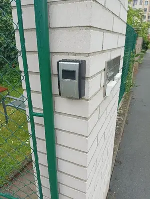 a wall with a tv on the side of a building at Sweet home apartment Kobylisy in Prague