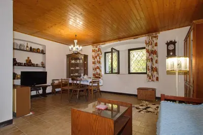 a living room with a table and a dining room at Chalupa Všetice in Netvořice