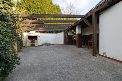 an outdoor patio with a wooden pergola at Chalupa Všetice in Netvořice