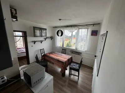 a wii controller sitting on top of a shelf at Private rooms, stunning city views, top-floor with balcony, bathtub, Internet, coffee in Prague