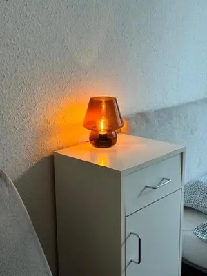 a lamp on top of a white night stand at Lužiny in Prague