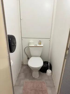 a small bathroom with a toilet in a stall at Lužiny in Prague