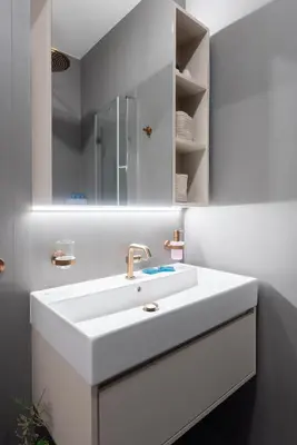 a white bathroom with a sink and a mirror at Urban Hideaway in Prague