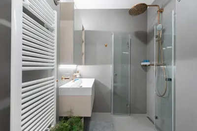 a bathroom with a sink and a shower at Urban Hideaway in Prague