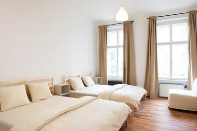 a living room with two beds and a couch at Masaryk Lounge in Prague