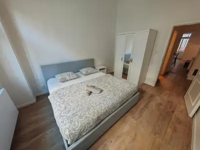 a bedroom with a bed with two towels on it at Modern 1BR in trendy Žižkov in Prague