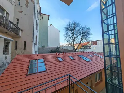 a red roof with windows on top of a building at Modern 1BR in trendy Žižkov in Prague