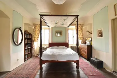 a bedroom with a canopy bed in a room at Suite at Château Domoušice in Domoušíce