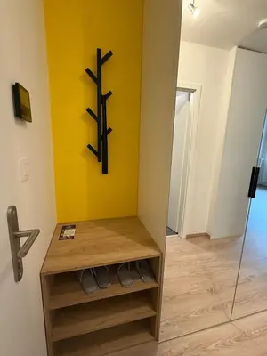 a room with a cross on a yellow wall at Kubánské náměstí in Prague