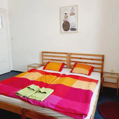 a bedroom with a bed with two towels on it at Just 3 min Walk Old Town Center private room A in Prague
