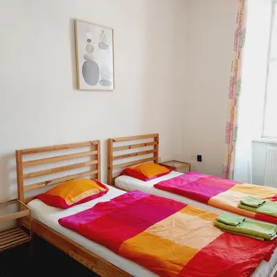 two beds sitting next to each other in a bedroom at Just 3 min Walk Old Town Center private room A in Prague