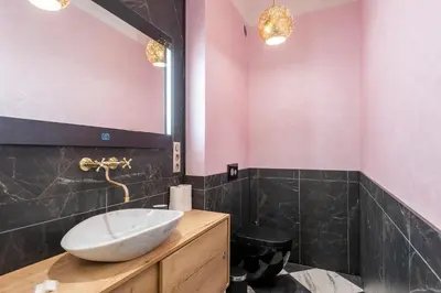 a bathroom with a sink and a mirror at Casa Nuova in Prague