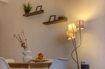 a dining room with a table and a lamp at Cozy Apartment in central Prague near Wenceslas Sq in Prague