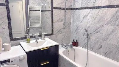 a bathroom with a sink and a bath tub at Cozy Apartment in central Prague near Wenceslas Sq in Prague