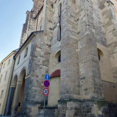 a building with a tower with a sign in front of it at Just 3 min Walk Old Town Center private room E in Prague