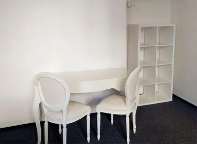two chairs sitting next to a white desk and shelves at Just 3 min Walk Old Town Center private room E in Prague