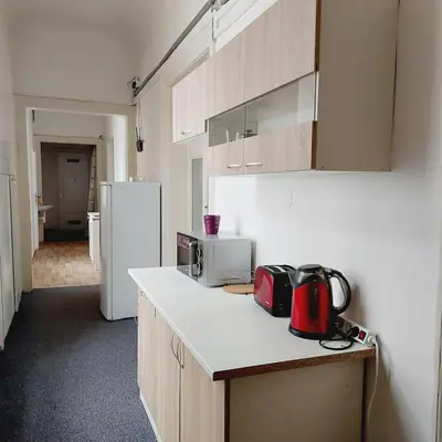 a kitchen with a counter with a microwave and a refrigerator at Just 3 min Walk Old Town Center private room C in Prague