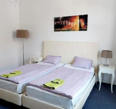 two beds sitting next to each other in a room at Just 3 min Walk Old Town Center private room D in Prague