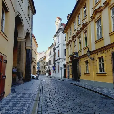 a cobblestone street in a city with buildings at Just 3 min Walk Old Town Center private room D in Prague