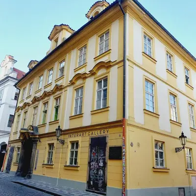 a yellow building on the side of a street at Just 3 min Walk Old Town Center private room D in Prague