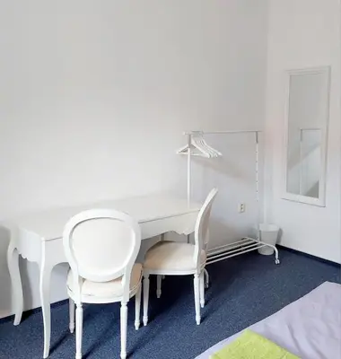 a white table and chairs in a white room at Just 3 min Walk Old Town Center private room D in Prague