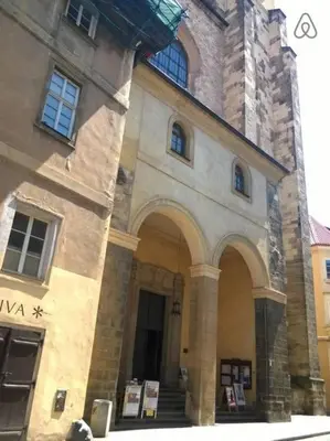 a large stone building with stairs and a tower at 3 min Walk Old Town Center private room A in Prague