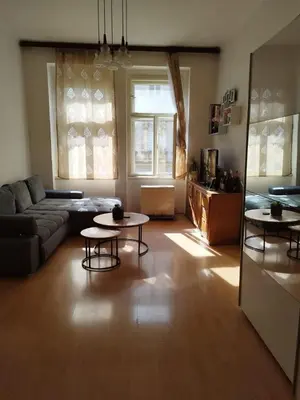 a living room with a couch and two tables at Apartment Near City Center! in Prague