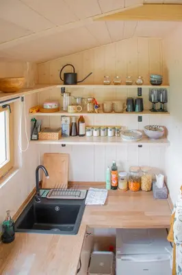 a kitchen with a sink and a counter top at Tiny u koníků