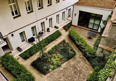 an aerial view of a building with a garden at The Hrad nest in Prague