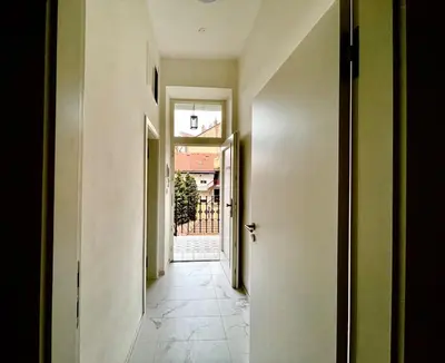 an empty hallway with a hallway leading to a door at The Hrad nest in Prague