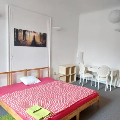 a bedroom with a bed and a table and chairs at 3 min Walk Old Town Center private room C in Prague