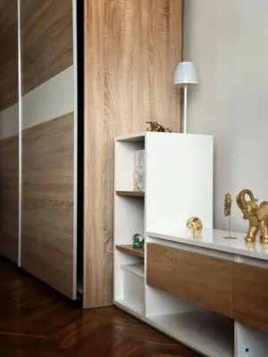 a room with a white cabinet with a lamp on it at Kamenicka new! in Prague