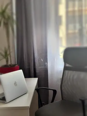 a laptop computer sitting on a desk next to a window at Kamenicka new! in Prague