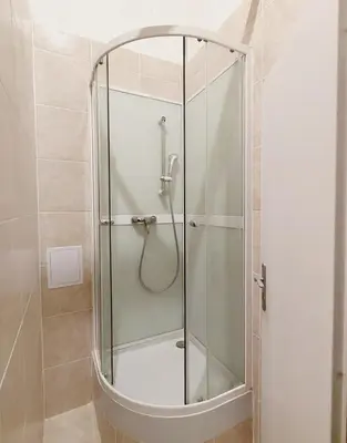 a shower with a glass door in a bathroom at Charles bridge, Old town3 Min walk Private Room B in Prague