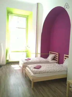 two beds in a room with purple walls and a window at Charles bridge, Old town3 Min walk Private Room F in Prague