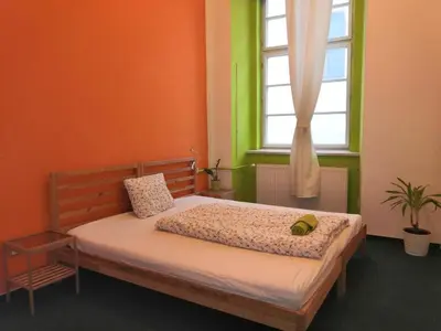 a bedroom with a large bed with a window at Charles bridge, Old town3 Min walk Private Room G in Prague