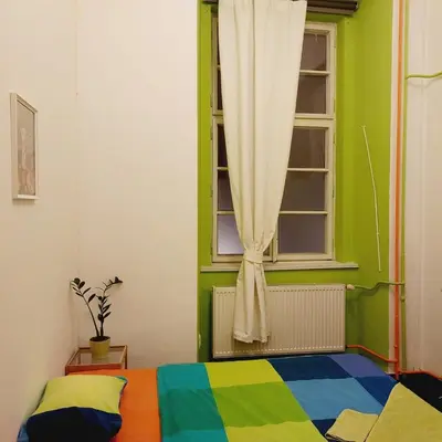 a bedroom with a colorful bed and a window at Charles bridge, Old town3 Min walk Private Room H in Prague