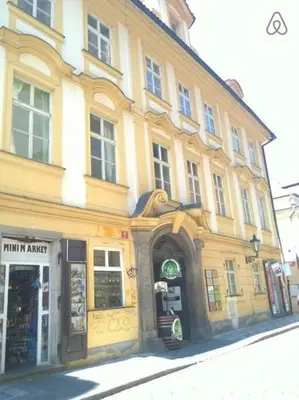 a large building on a city street with a store at Charles bridge, Old town3 Min walk Private Room H in Prague