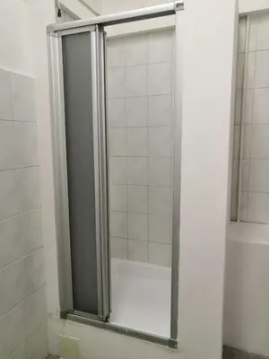 a shower with a glass door in a bathroom at Old Town Center Just in 3 min Walk private room C in Prague