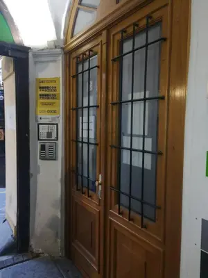 a pair of wooden doors in a building at Old Town Center Just in 3 min Walk private room D in Prague