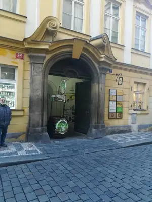 an entrance to a building with a man standing outside at Old Town Center Just in 3 min Walk private room D in Prague