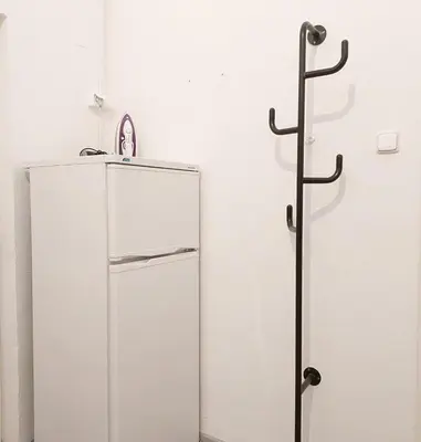 a white refrigerator sitting in a room next to a wall at Old Town Center Just in 3 min Walk private room D in Prague