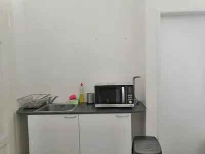 a kitchen counter with a microwave and a sink at Old Town Center Just in 3 min Walk private room D in Prague