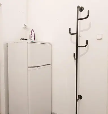 a glass refrigerator in a white room next to a wall at Old Town Center Just in 3 min Walk private room E in Prague