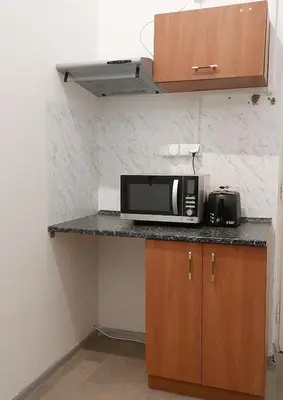 a microwave sitting on a counter in a kitchen at Old Town Center Just in 3 min Walk private room E in Prague