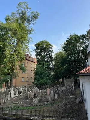 a group of graves in front of a building at Authentically stylish apartment with a mystical view GOLEM in Prague