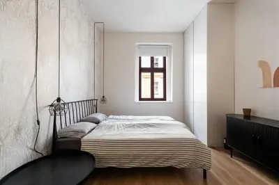 a bedroom with a bed and a window at Good Mood in the Zizkov Hood Prague in Prague