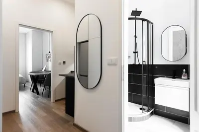 a bathroom with a sink and a mirror at Good Mood in the Zizkov Hood Prague in Prague