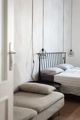 two beds in a room with a chair and lamps at Good Mood in the Zizkov Hood Prague in Prague